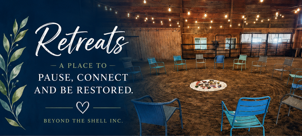 Chairs arranged in a circle inside a rustic barn for a Beyond The Shell retreat.